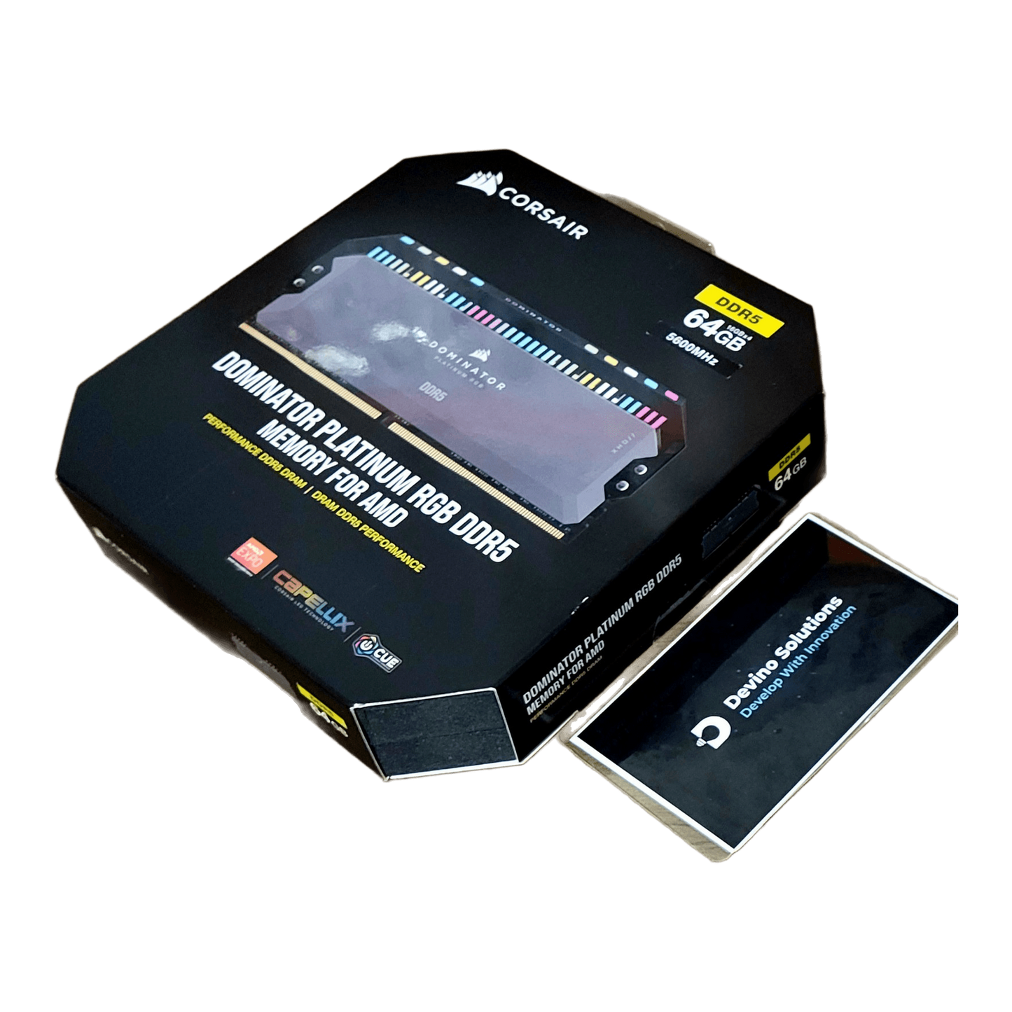 Corsair Dominator Platinum RGB DDR5 64GB (4x16GB) 5600MHz CL36 AMD XMP — authentic angled box front; Devino card corner