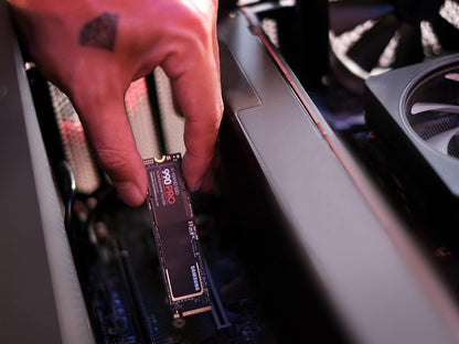 Samsung 990 PRO 2TB NVMe PCIe 4.0 SSD — being fitted into a desktop PC