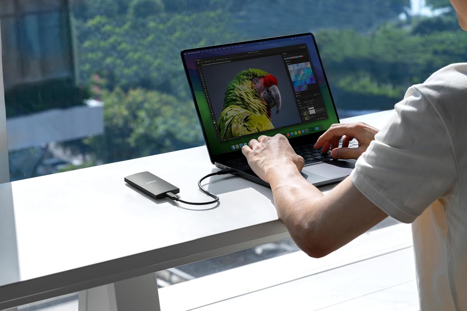 Lexar SL300 2TB Portable SSD (USB 3.2 Gen 2, up to 1050MB/s) — connected to a laptop in use