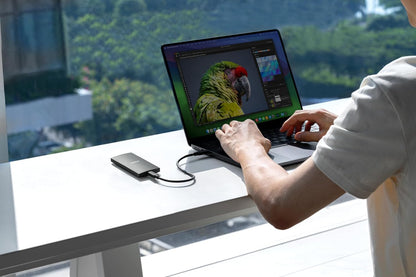 Lexar SL300 2TB Portable SSD (USB 3.2 Gen 2, up to 1050MB/s) — connected to a laptop in use