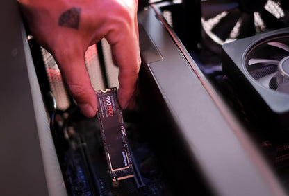 Samsung 990 PRO 1TB NVMe PCIe 4.0 SSD — being fitted into a desktop PC