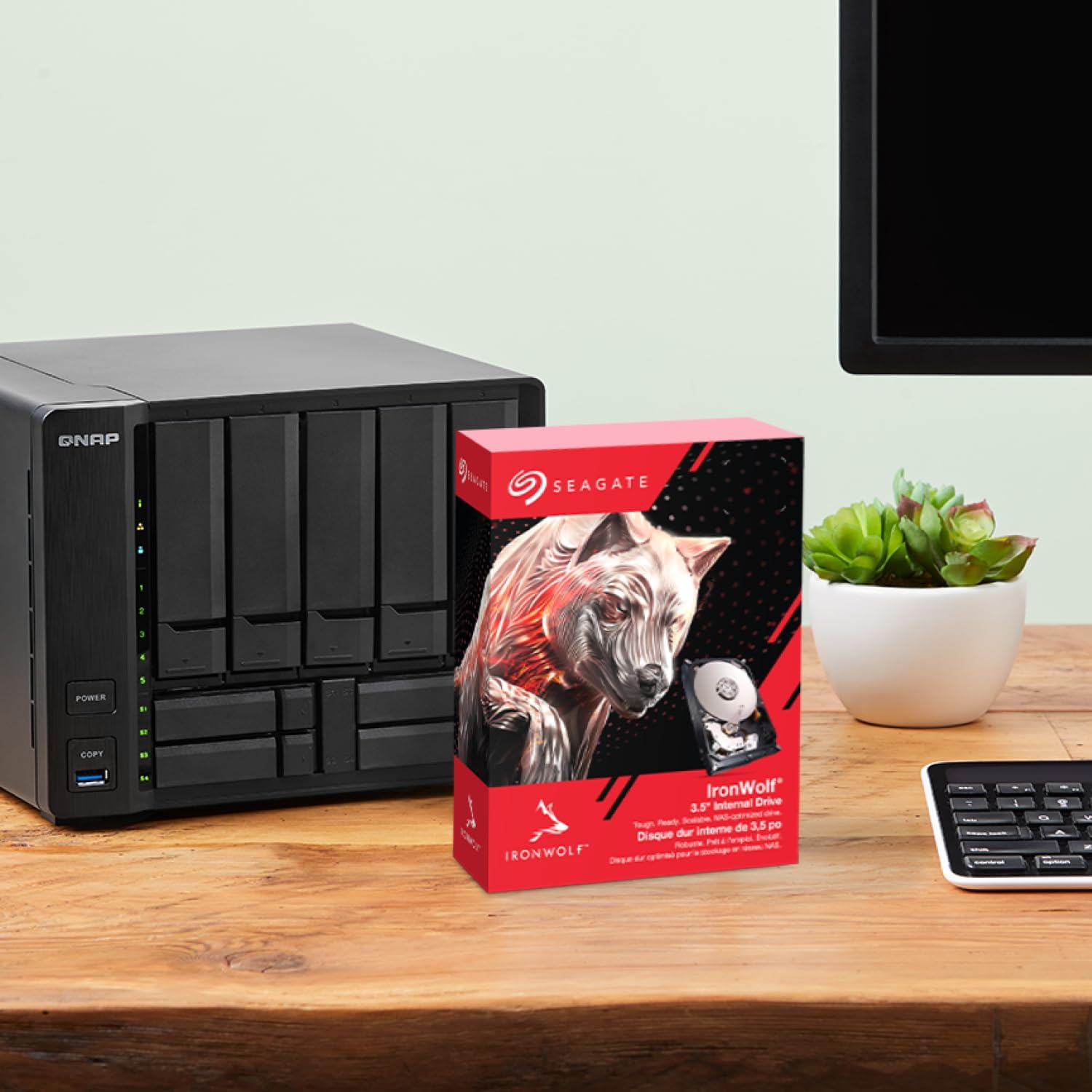 Seagate IronWolf 4TB 3.5" 5400RPM SATA NAS Internal Hard Drive — retail box beside a NAS enclosure