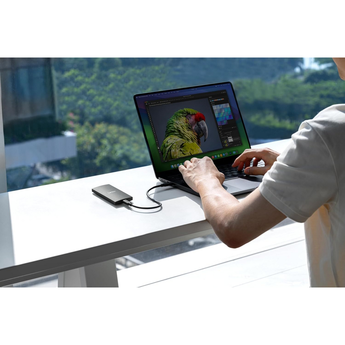Lexar SL300 2TB Portable SSD (USB 3.2 Gen 2, up to 1050MB/s) — connected to a laptop in use