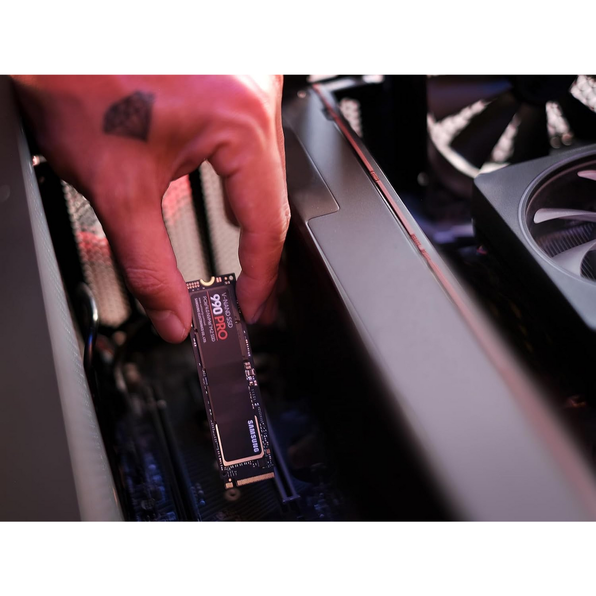 Samsung 990 PRO 2TB NVMe PCIe 4.0 SSD — being fitted into a desktop PC