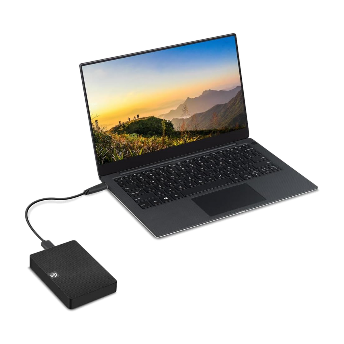 Seagate Expansion 5TB USB 3.0 Portable External Hard Drive — connected to a laptop